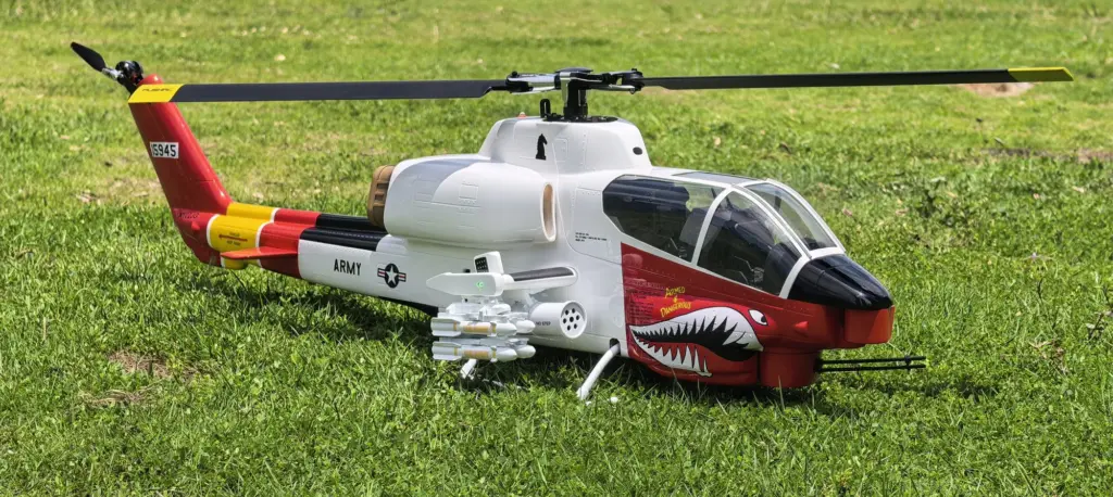 FLISHRC AH-1 Cobra white and red 500-size scale RC helicopter with shark-mouth nose art on grass