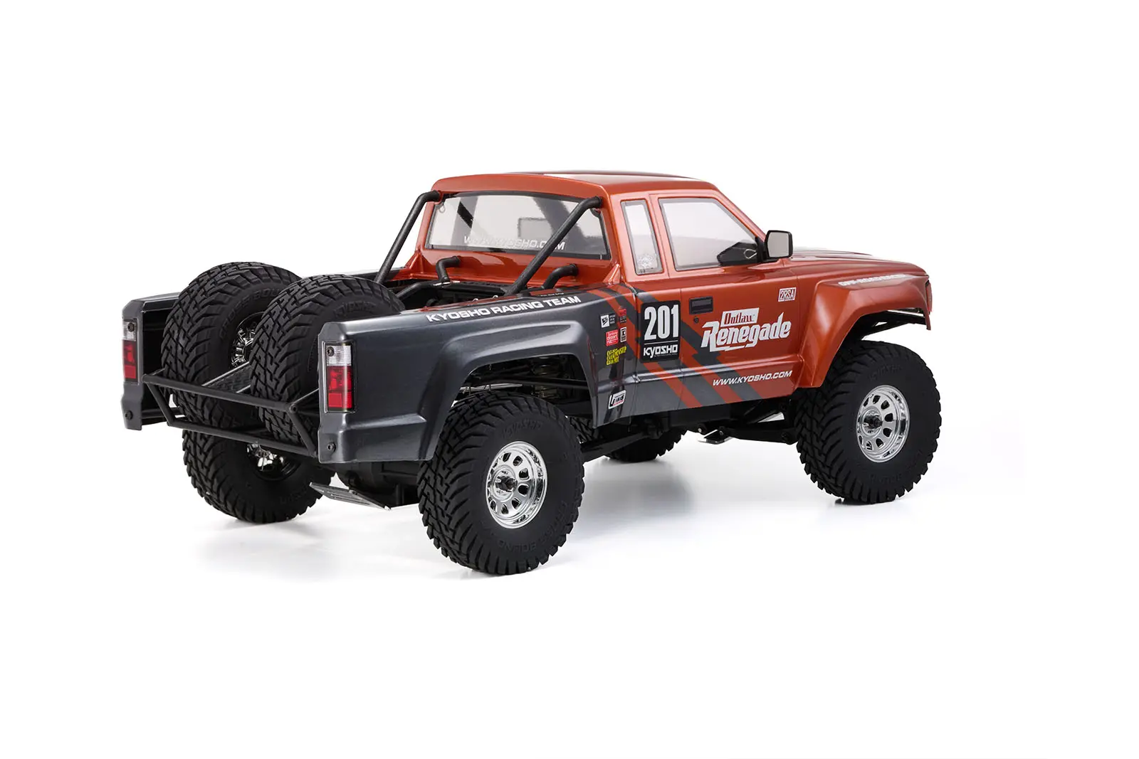 Kyosho Outlaw Renegade Pro Kit 1:10 2WD electric pickup truck, rear three-quarter view showing the spare tyres