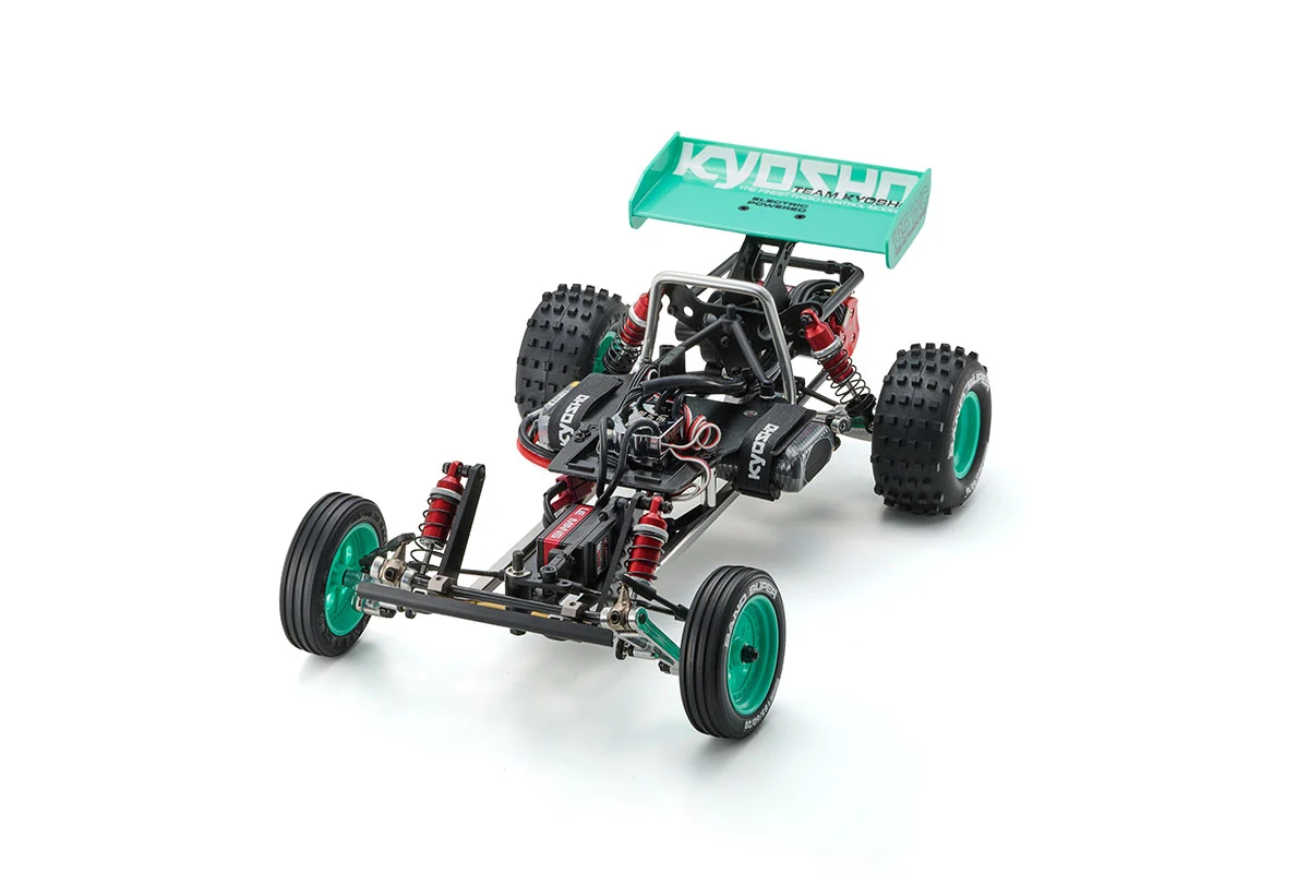 Kyosho Tomahawk '85 WC Worlds Spec — front three-quarter studio shot of the rolling chassis with rear wing fitted