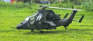 FLISHRC Tiger 700-size scale RC helicopter in green and black camouflage, side profile on grass