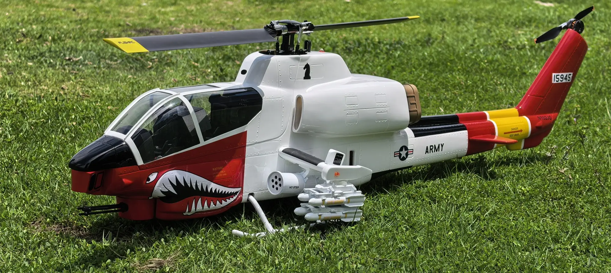 Starboard side of the FLISHRC AH-1 Cobra 500-size scale RC helicopter in white and red livery