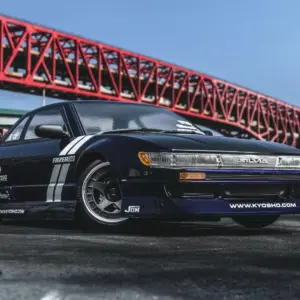 Kyosho Fazer D2 Nissan Silvia S13 Tuned purple RC drift car parked beneath a red steel bridge